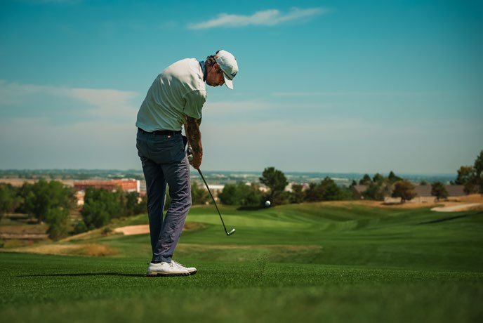 A golfer on a desert course